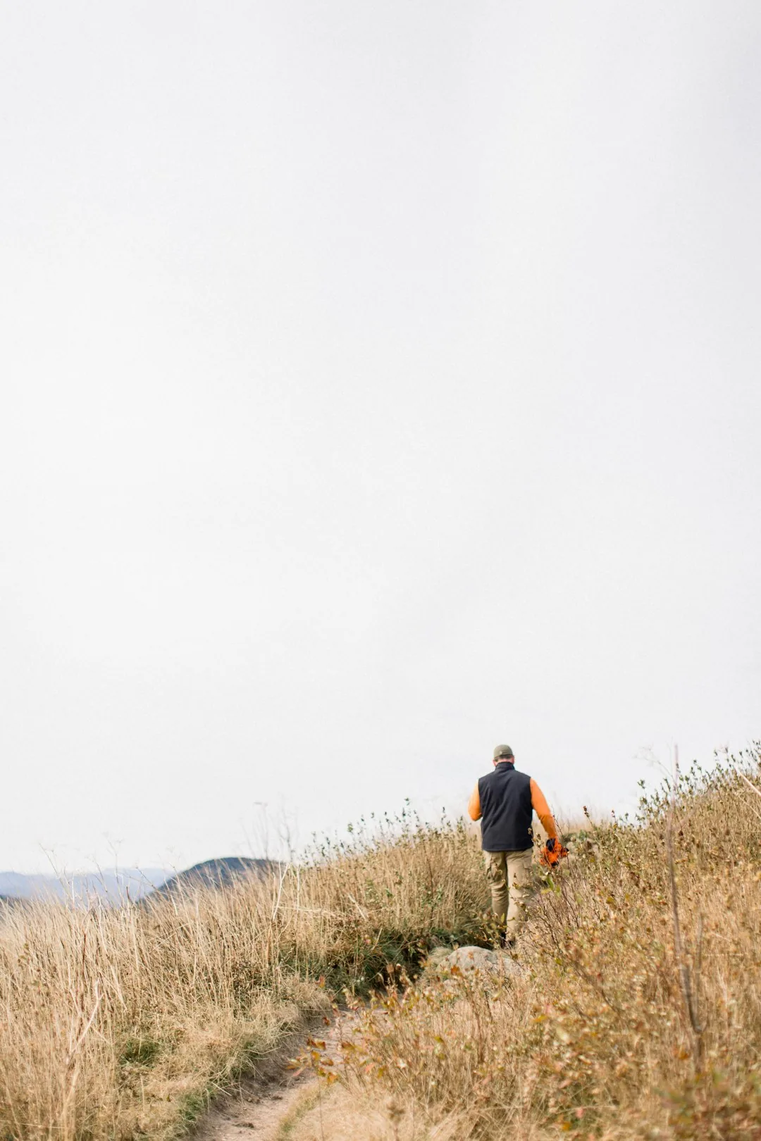 Portrait of guide Ken Tanaka on a ridge trail