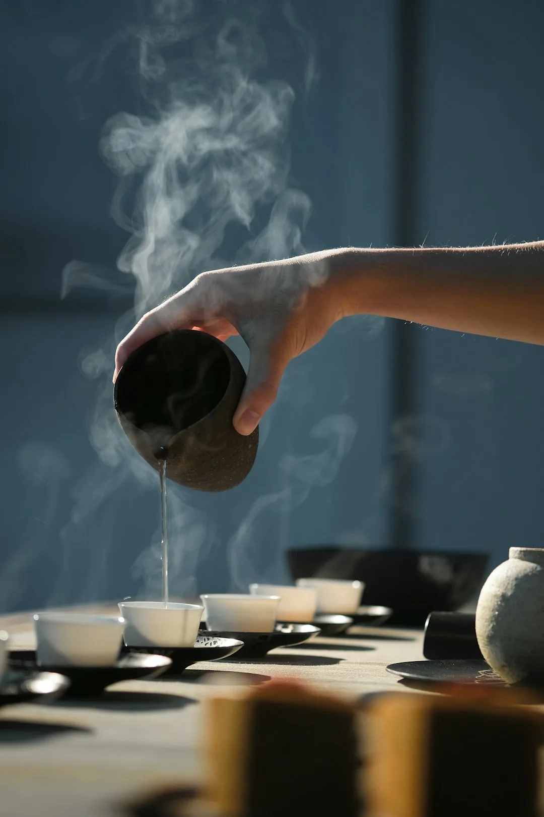 Seasonal wellness walk through turning forest with a guide pouring tea
